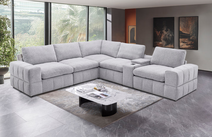 Salon d'Angle Modulable MIOVY / MB-2538 Structure en panneau de particules, assise mousse en polyuréthane recouverte de tissus microfibre gris. Dimensions : 320x288xH83cm LES + PRODUIT: Design moderne et élégant Grande capacité d'assise Configuration d'angle spacieuse Salon modulable selon l'espace Assises confortables et profondes Dossiers bien maintenus Console centrale intégrée Accoudoirs larges et confortables Tissu résistant, usage quotidien Structure stable et durable Idéal pour salon familial et convivialité